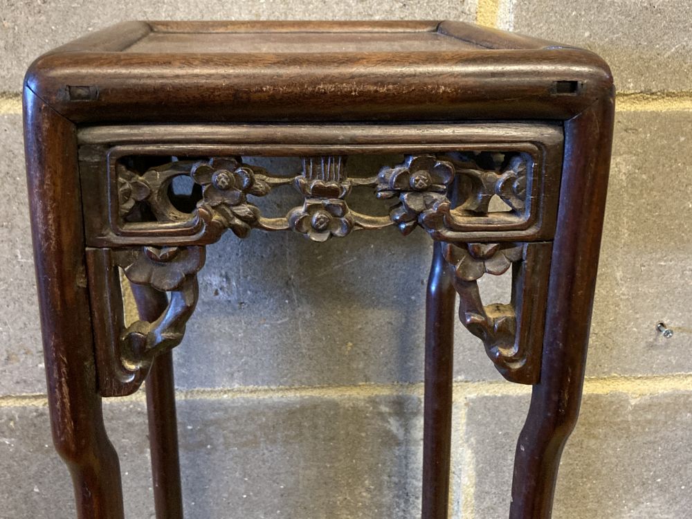 A Chinese carved hardwood square topped stand, width 23cm, height 56cm